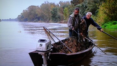 Photo de pecheurs sur leur barque